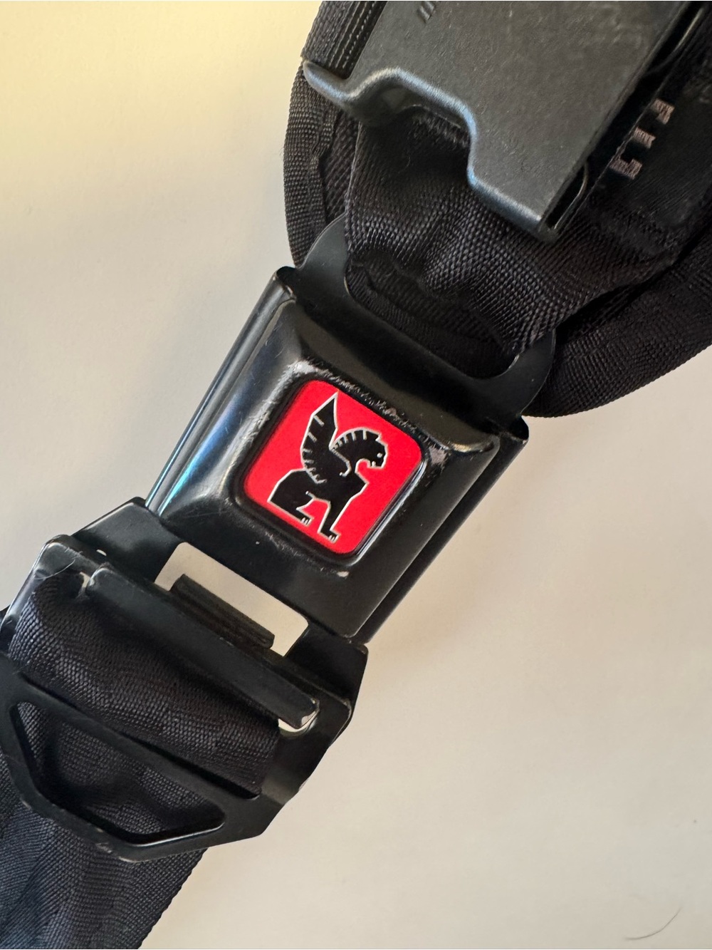 Chrome Industries Black Seatbelt Strap Messenger Bag in blue, white and red